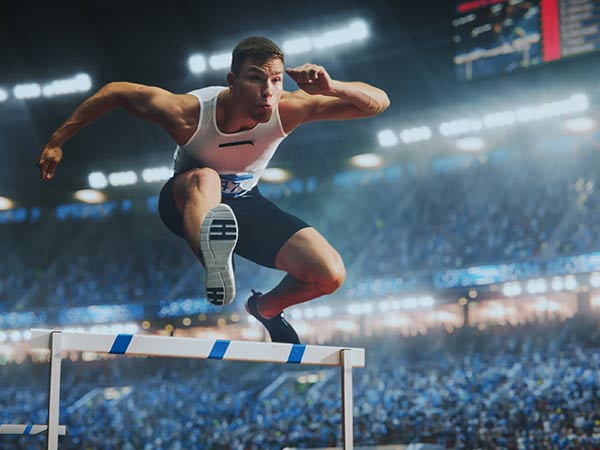 Runner Jumping Hurdles